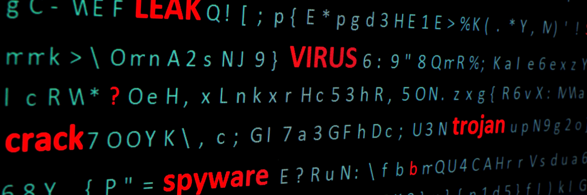 Side view of a pc monitor, a string of words leak, virus, spyware, Trojan highlighting in red font among a chaotic set of green computer symbols.