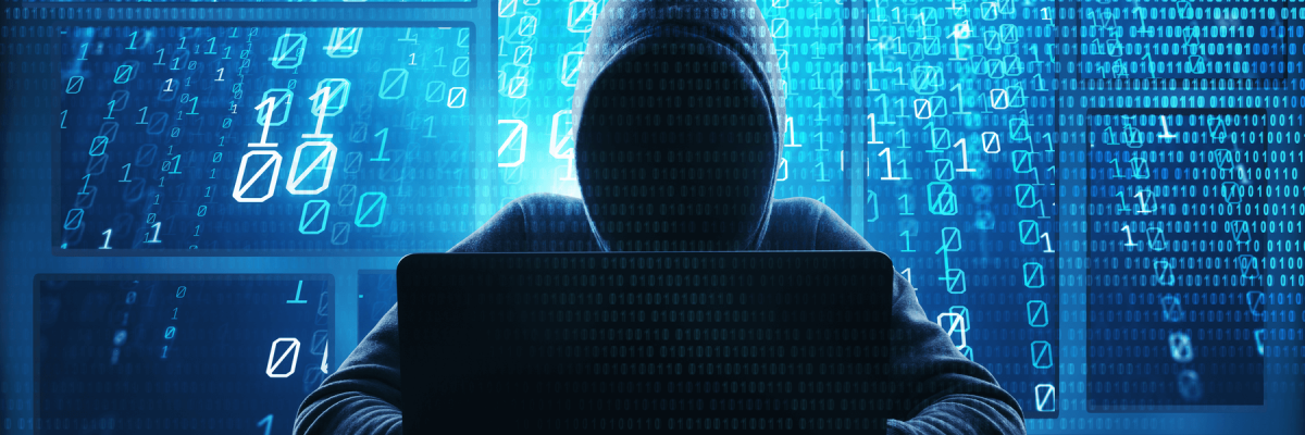 Double exposure, hooded hacker using abstract laptop with binary code digital interface. Hacking and malware concept.